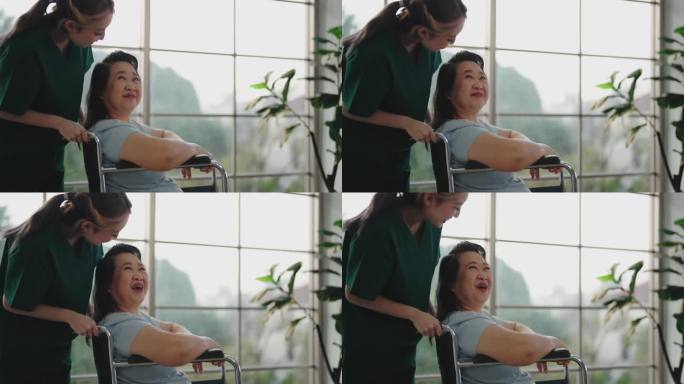 年轻的亚洲护士在照顾一位坐在轮椅上的老年妇女。