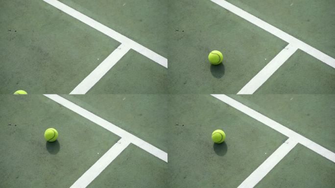 网球在球场上滚动着停了下来