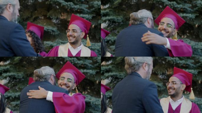 毕业典礼当天，快乐的男学生和老师在校园里拥抱、握手、交谈