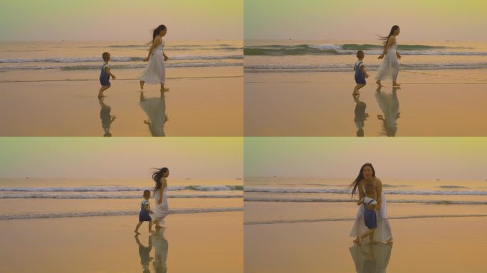妈妈和儿子在沙滩上奔跑嬉戏玩耍傍晚海边玩