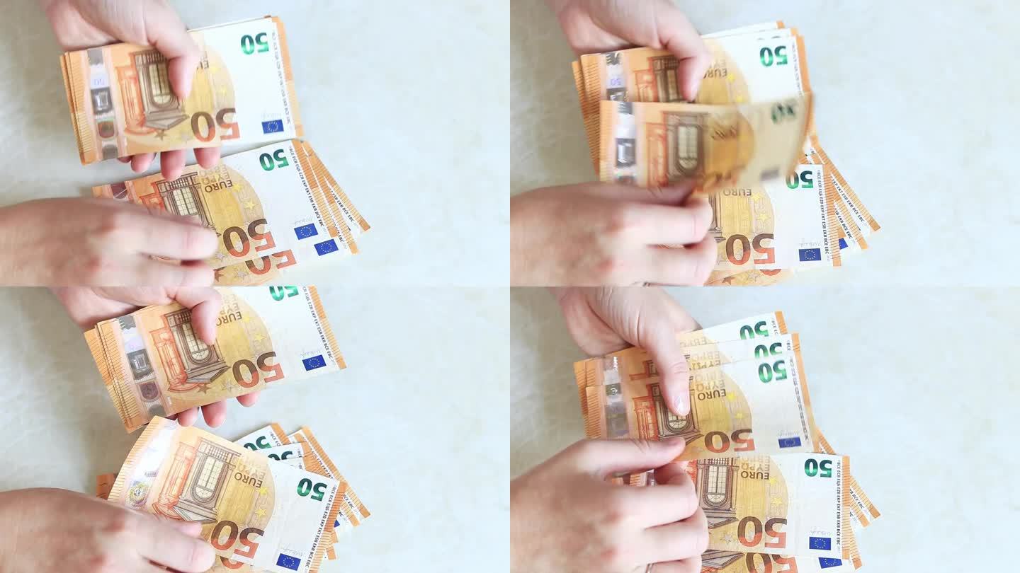 数钞票，特写。手里有钱，50欧元的钞票