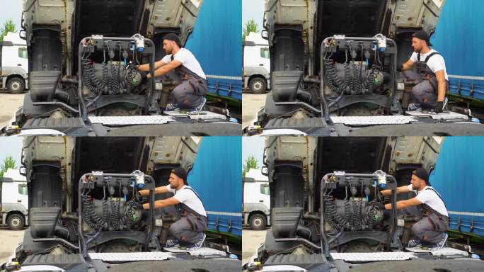 修理工正在修理卡车。柴油发动机卡车。汽车维修店