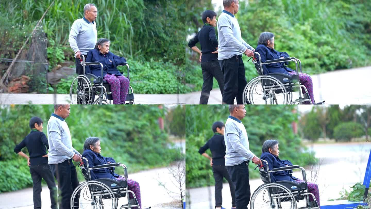 老爷爷推着坐轮椅的老奶奶，一辈子相扶到老