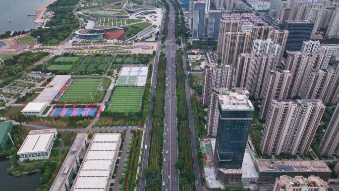 航拍傍晚日照市东港区烟台路山东体育学院