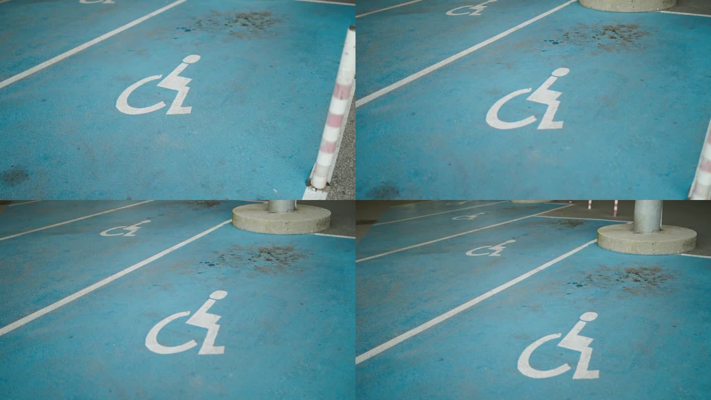 超市或商场内为残障司机预留的停车场。残障人士停车位。沥青停车场的轮椅标志油漆。残疾人停车场。