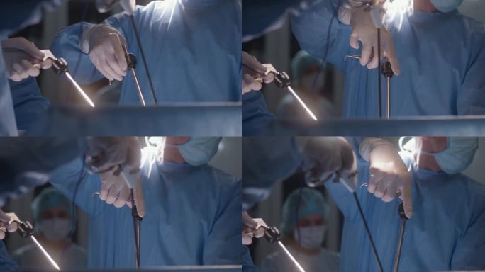 外科手术中使用腹腔镜仪器的医护人员近照