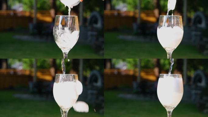 把冰块倒入玻璃杯里把冰块倒入苏打水扔柠檬用吸管搅拌几段冷饮的视频在街上桌子上泡着泡沫泡泡特写