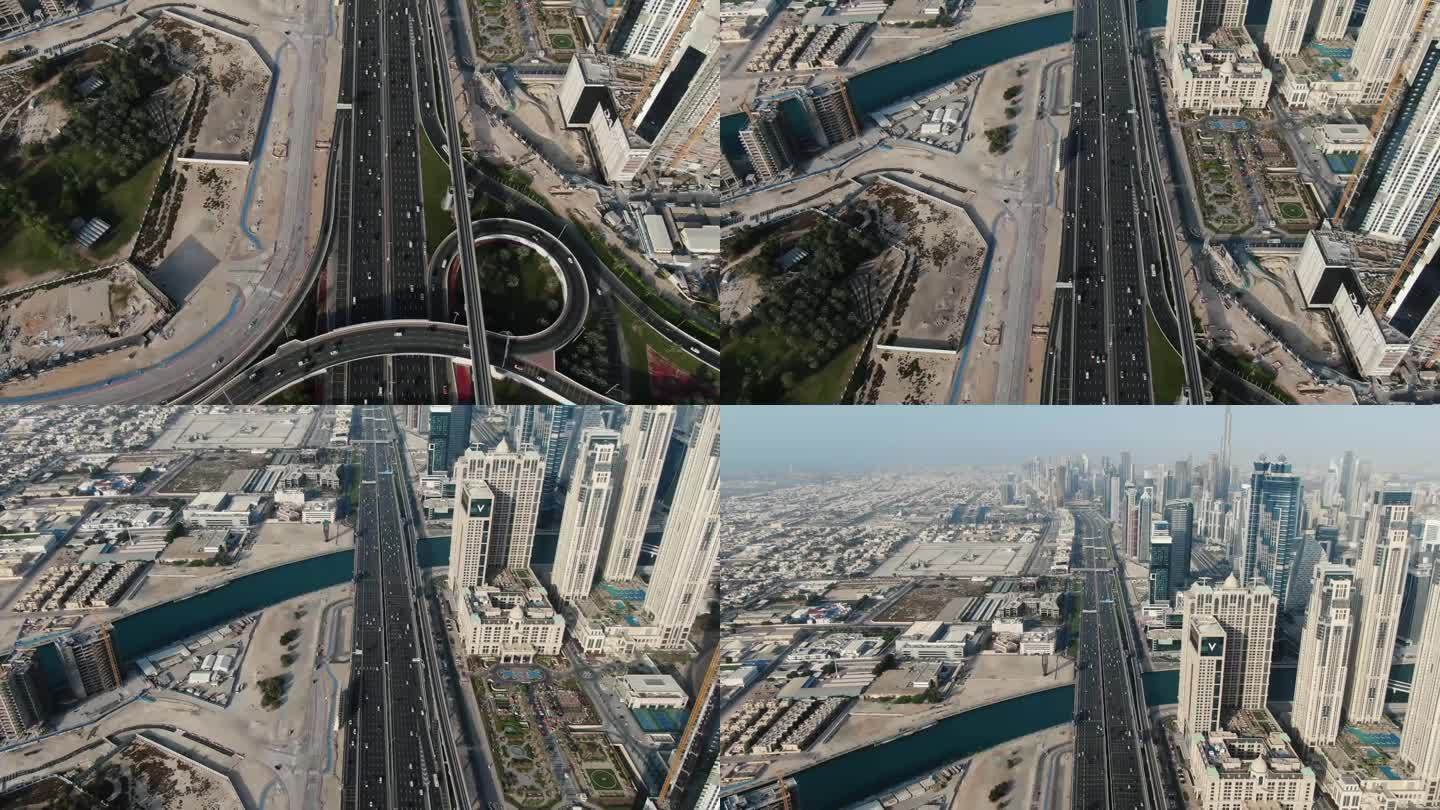 迪拜一个巨大的高速公路十字路口的航拍镜头，有很多交通，4k
