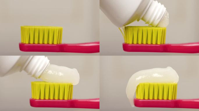 把牙膏挤到牙刷上。特写镜头运动