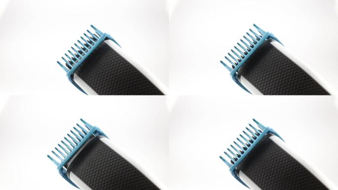 电动修剪器上的剪发器调整特写。用于美发的无线充电理发器