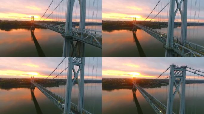 从低到高，在哈德逊河上令人惊叹的美国桥后面，粉色和金色的日出光