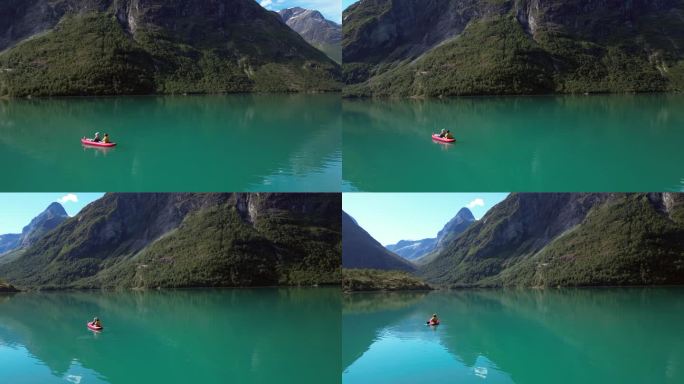 两个人在挪威的一个原始湖泊上划独木舟