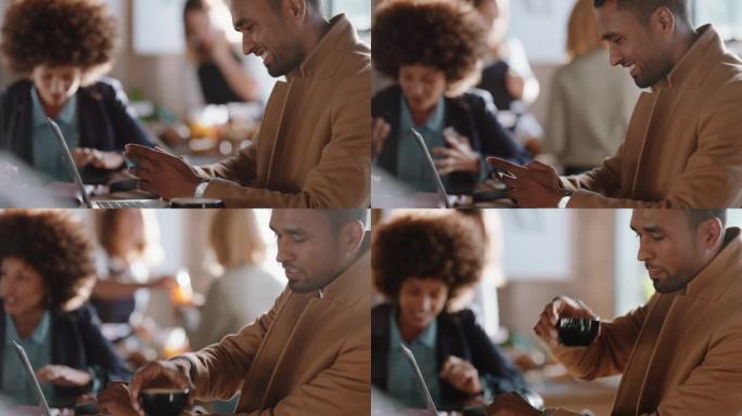 年轻的商人在咖啡馆里用笔记本电脑浏览智能手机上的信息，喝着咖啡在繁忙的餐馆里在线工作