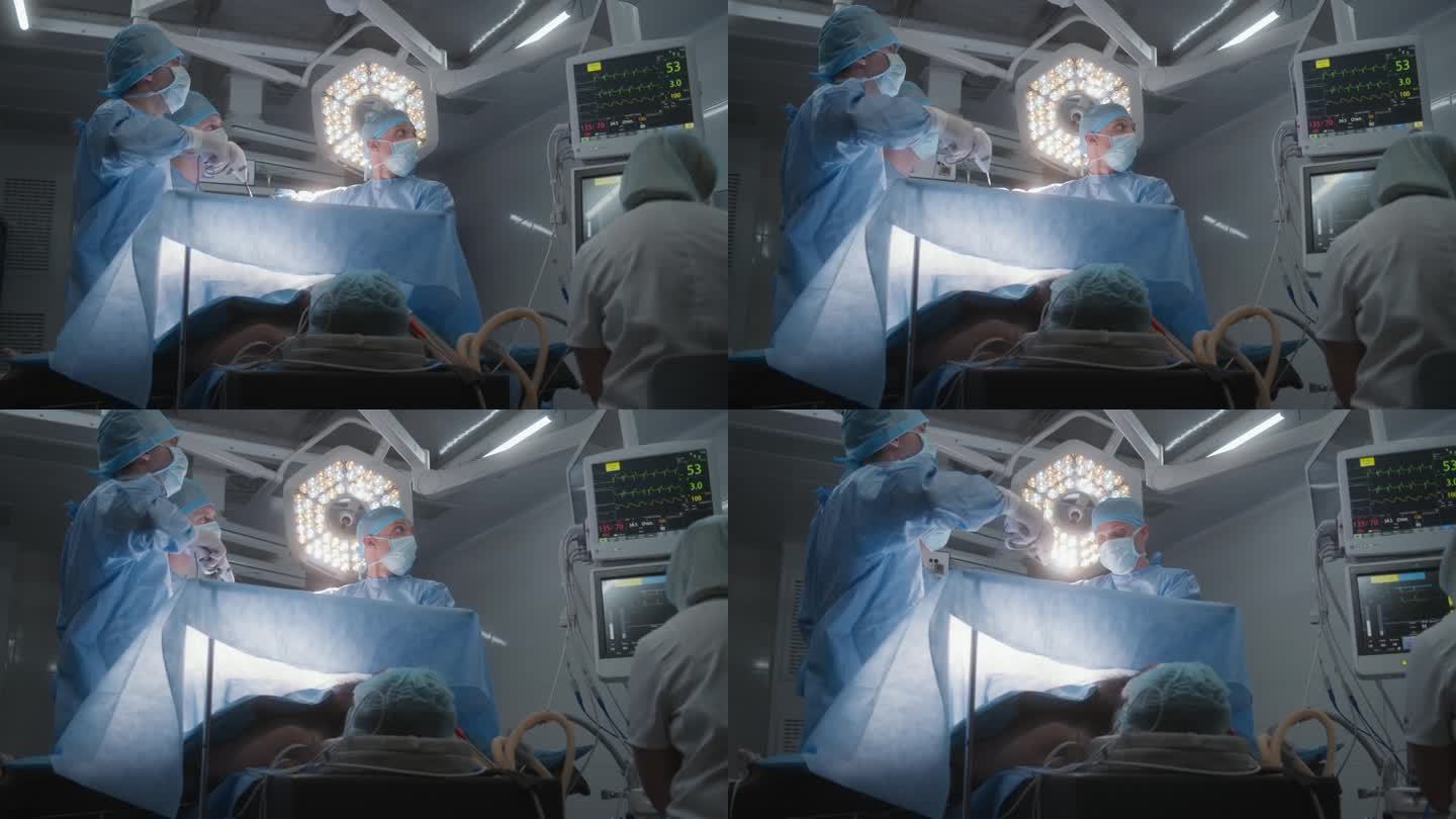 护士在心电图监护仪上检查病人的情况