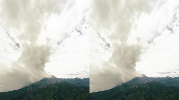 垂直视频。空中绿色丛林森林喷发火山冻结岩石熔岩