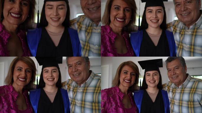 父母和刚毕业的女儿在家里的照片