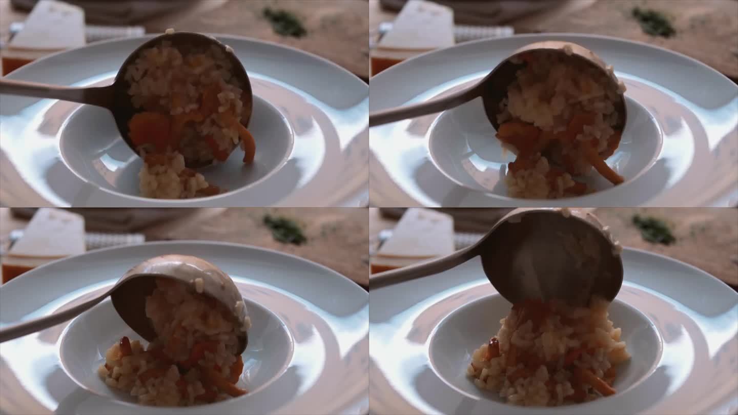 厨师将意式蘑菇烩饭(意式蘑菇饭)放入盘中