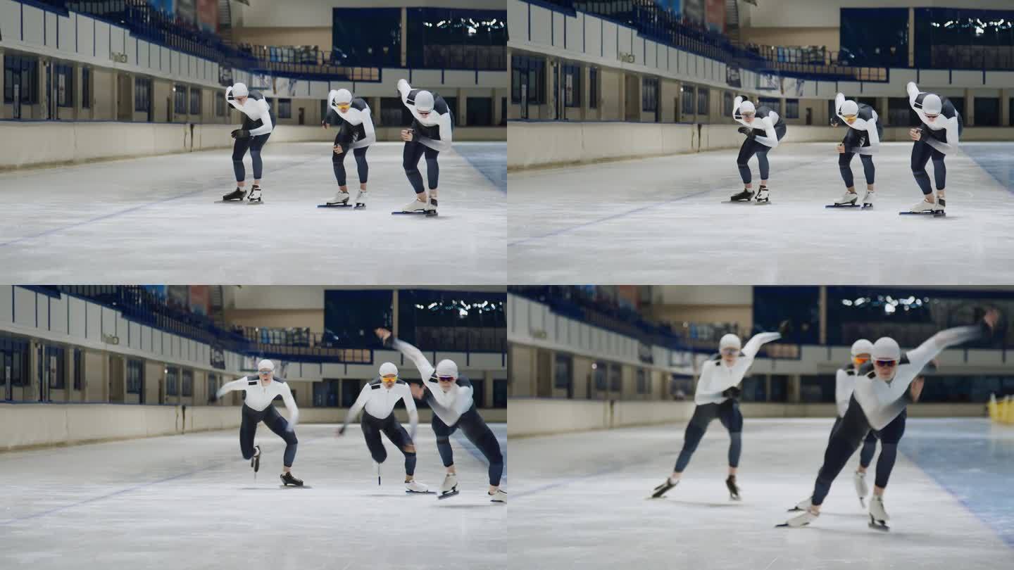 三名速滑选手在溜冰场跑道上训练