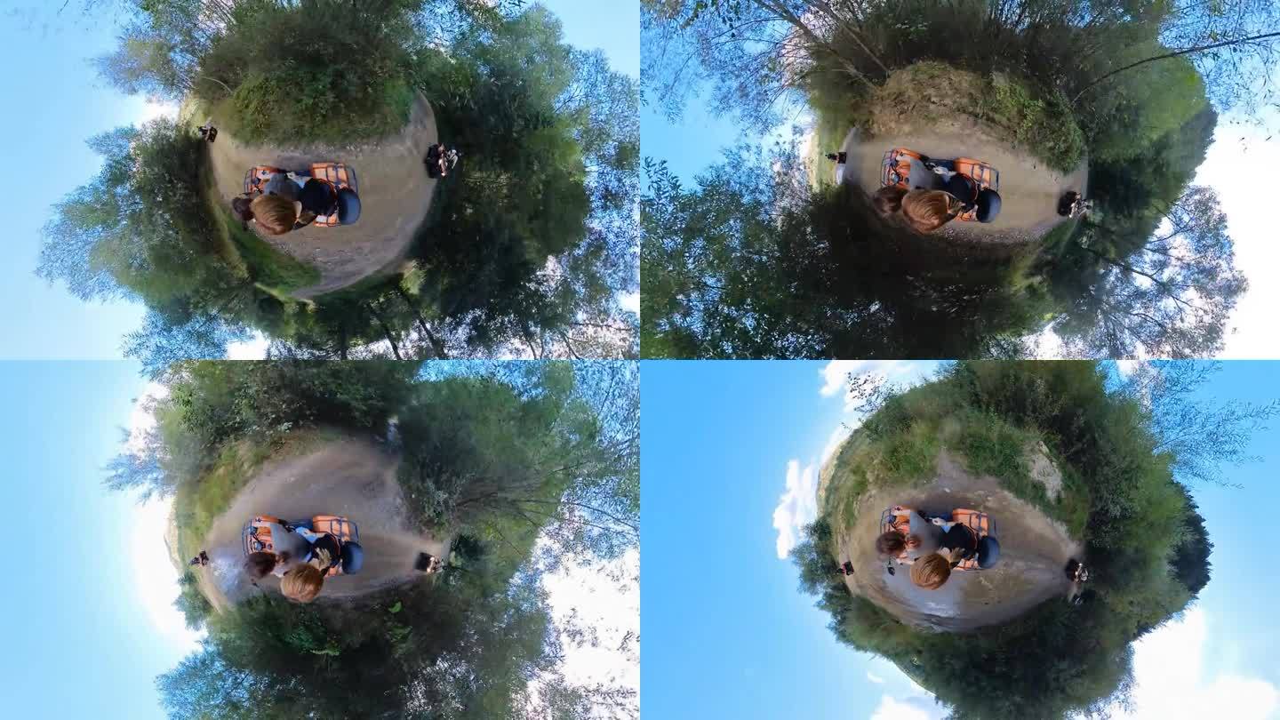 两个年轻女人在自然公园里开着一辆四轮摩托车。罗马尼亚。