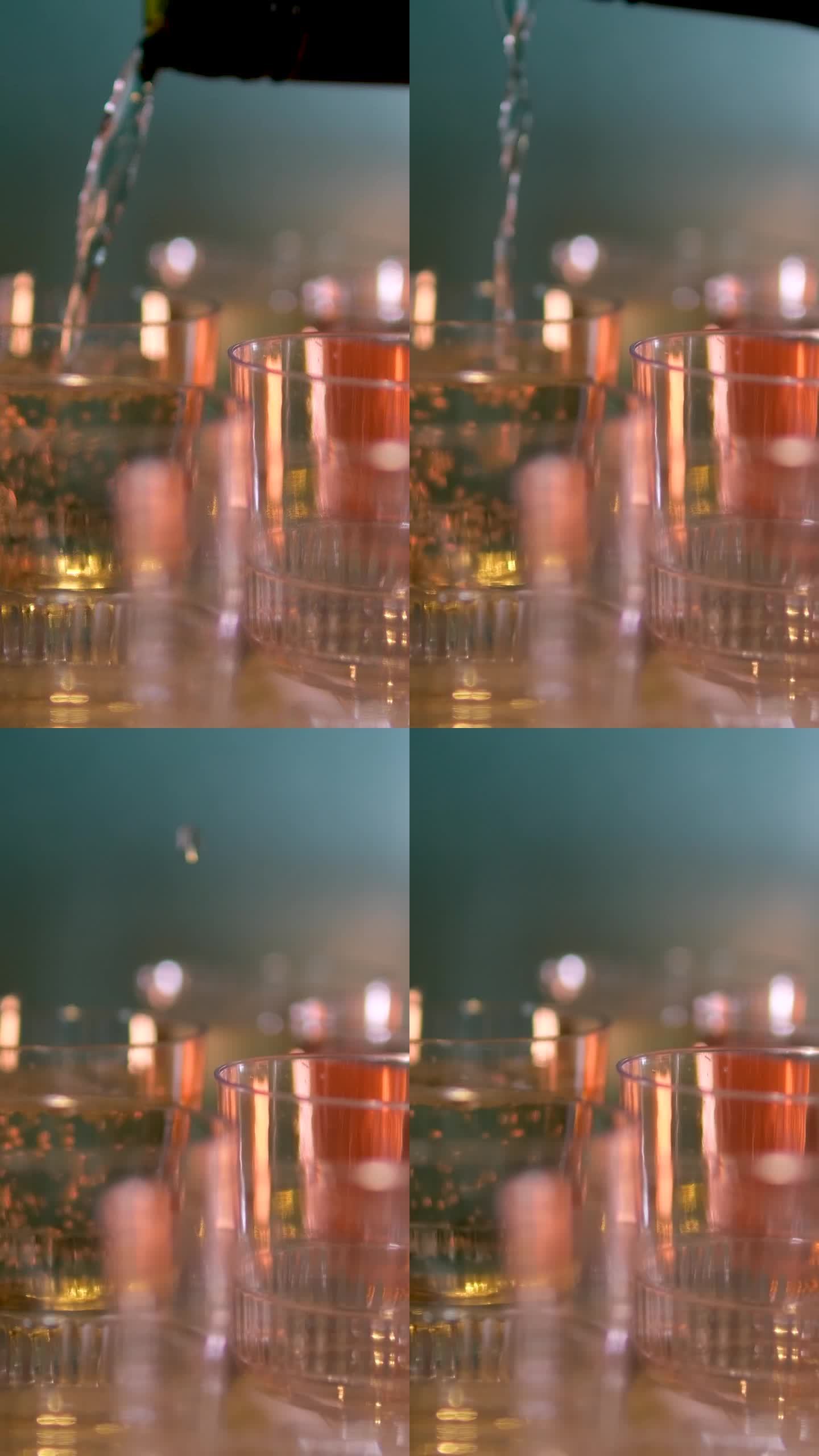 自助餐桌子玫瑰酒在玻璃塑料一次性杯慢动作视频美味的饮料从瓶子倒在细流晚上公司假期新年公司庆祝假期周末