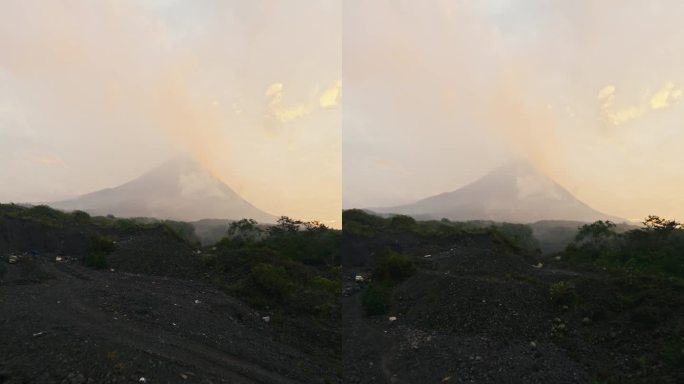 垂直视频。史诗般的热带森林峡谷冰封火山熔岩烟喷发