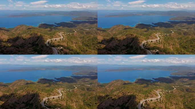 空中无人机拍摄的马尔马里斯半岛美丽的风景，山脉和丘陵，绿色的树林和弯弯曲曲的道路。环绕着爱琴海和地中