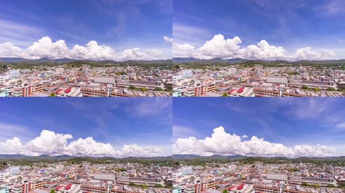 城市和山脉的延时视频与移动的云和蓝天