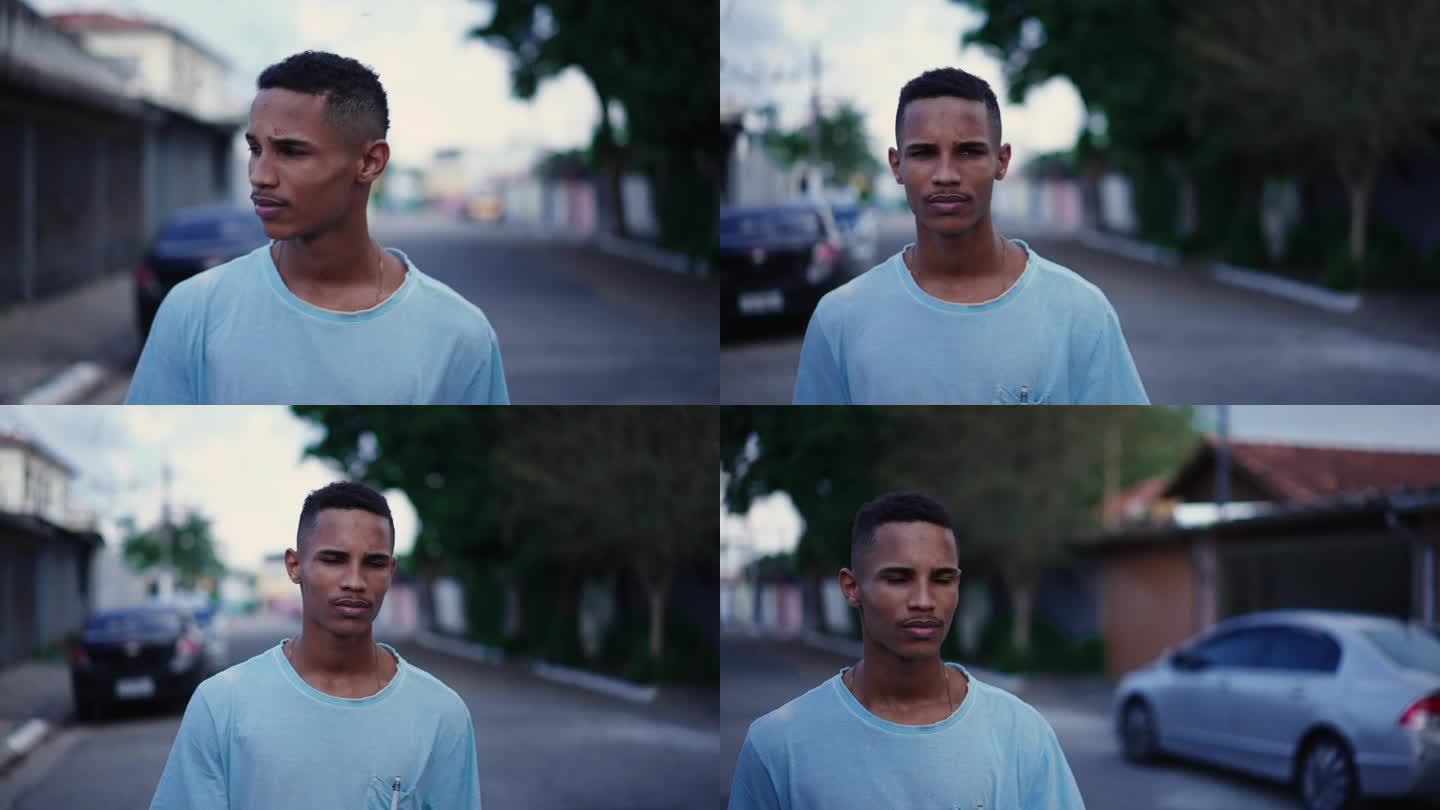 一个自信的年轻黑人走在街上。跟踪拍摄了一个非洲裔人在城市环境中外出行走的特写脸、人生的旅程概念