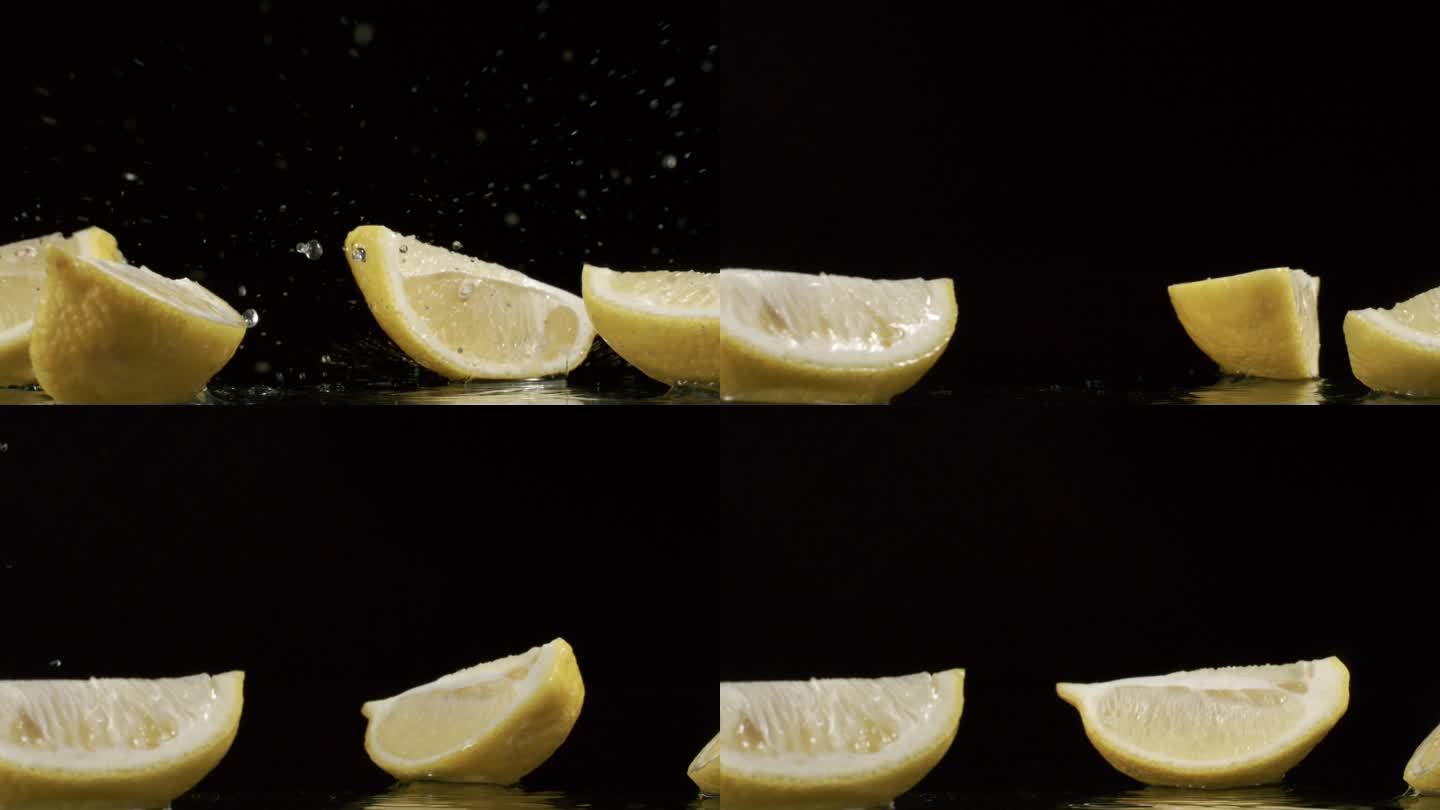 柠檬在黑背景上落下散开水花飞溅4k慢镜头