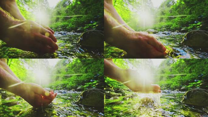 男子在树林里的河里玩水。手捧清泉。清水如水晶