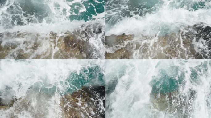 从俯视的慢镜头中，我们观察到海浪是如何撞击岩石海岸线并退回大海的。