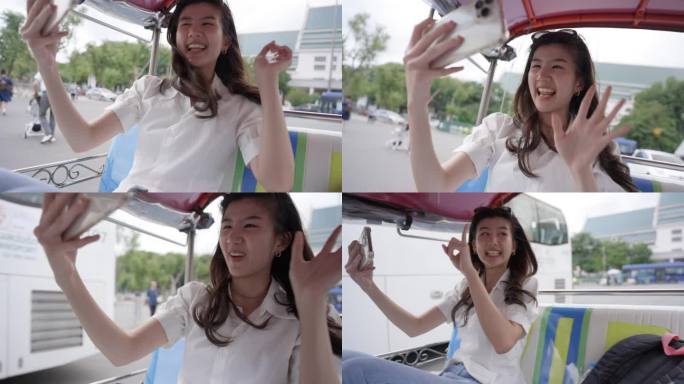 年轻的亚洲女子在泰国曼谷的嘟嘟车上微笑并直播:慢动作