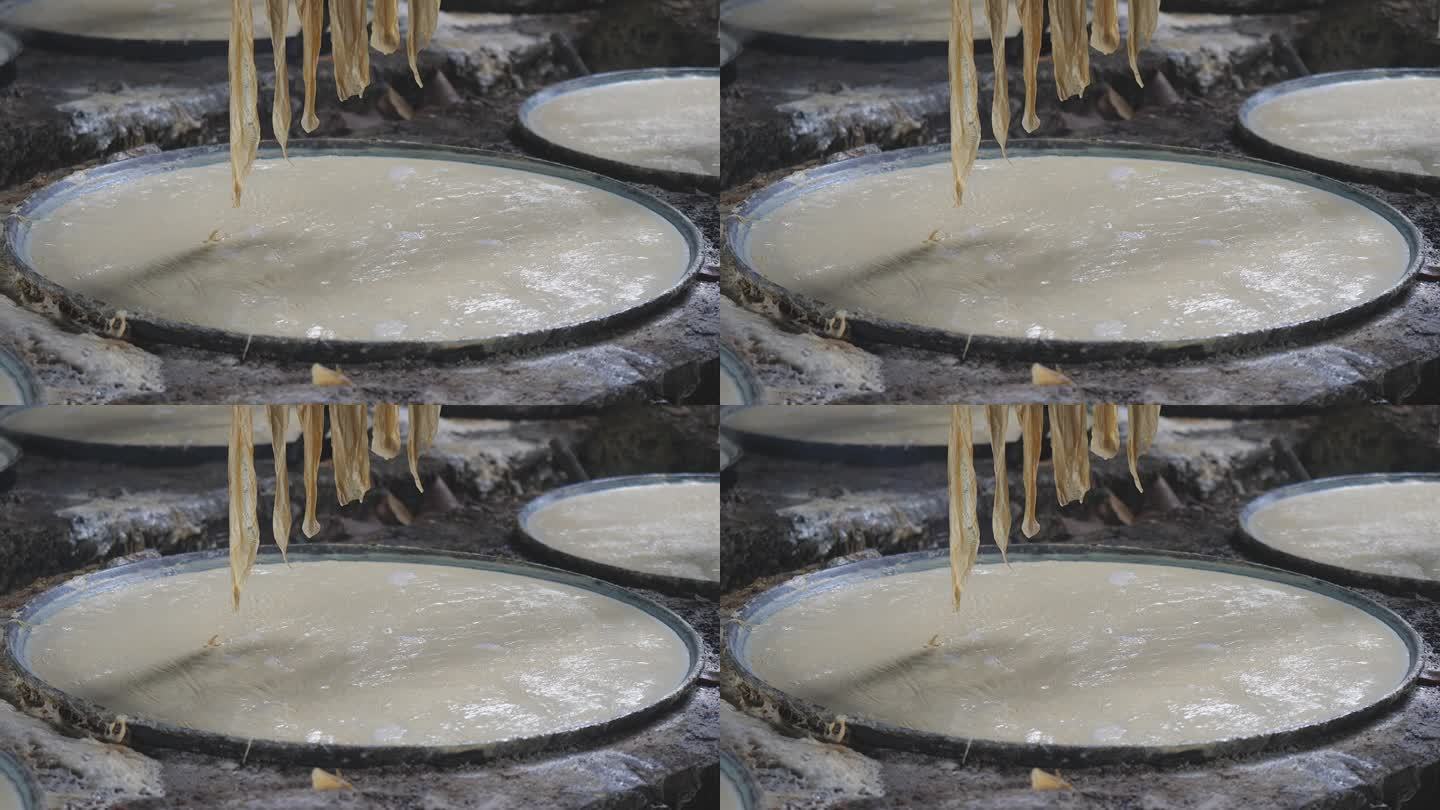热豆浆冷却后，表面会形成一层薄薄的豆浆。