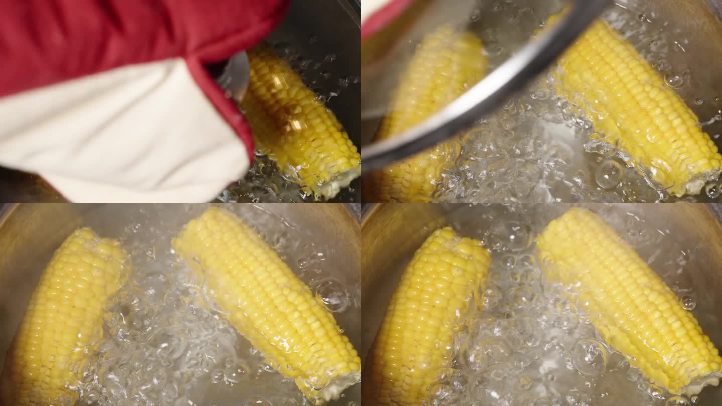 当我打开锅盖时，两个煮熟的玉米棒正在锅里煨着。摄影机以移动摄影机的方式移动。慢动作