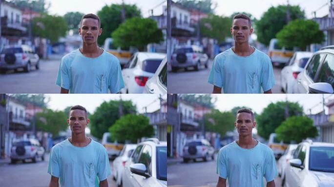 一个沉思的巴西黑人年轻人走在街上，凝视着沉思。一个深思熟虑的南美人正在向前走
