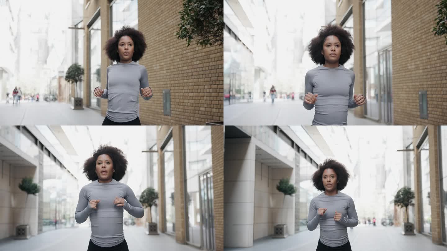 专注的成年黑人活跃女性在伦敦开始她的晨跑前热身