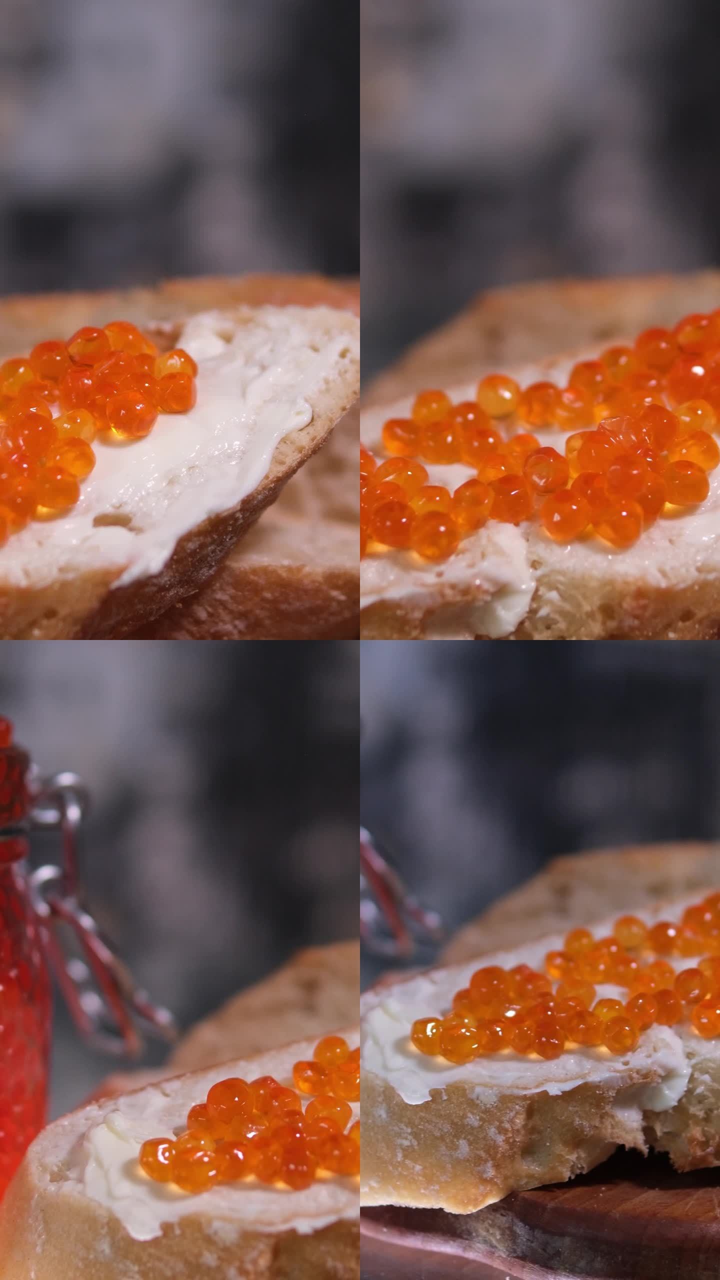 用刀把黄油涂在面包上背景是一个装有鱼子酱的玻璃罐切成薄片的法棍面包配鲑鱼鱼子酱和黄油，美味的面包黄油