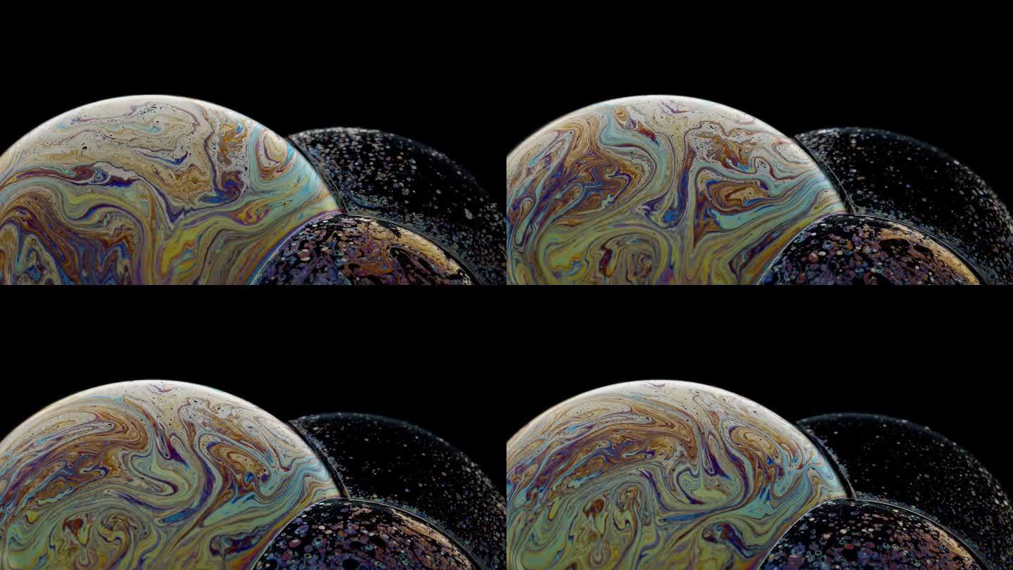 旋转的泡泡簇充满了五颜六色的图案，就像一个行星抽象的背景