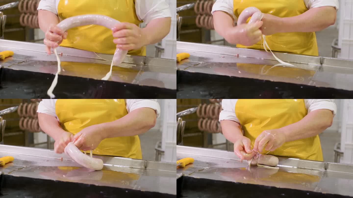 加工香肠的女工在肉厂用绳子固定末端。