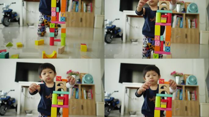 小男孩用许多五颜六色的木块搭起一座城市，进行创意玩具的设计
