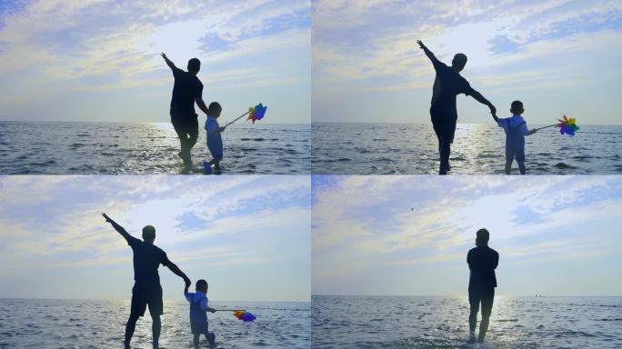 父子年轻爸爸牵着儿子海边散步意境父子举高