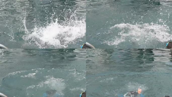 一个男孩享受暑假，快乐的孩子漂浮在游泳池，慢动作的场景