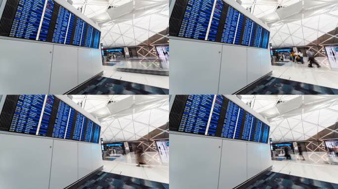 香港机场候机楼登机口、航班信息板的旅客。