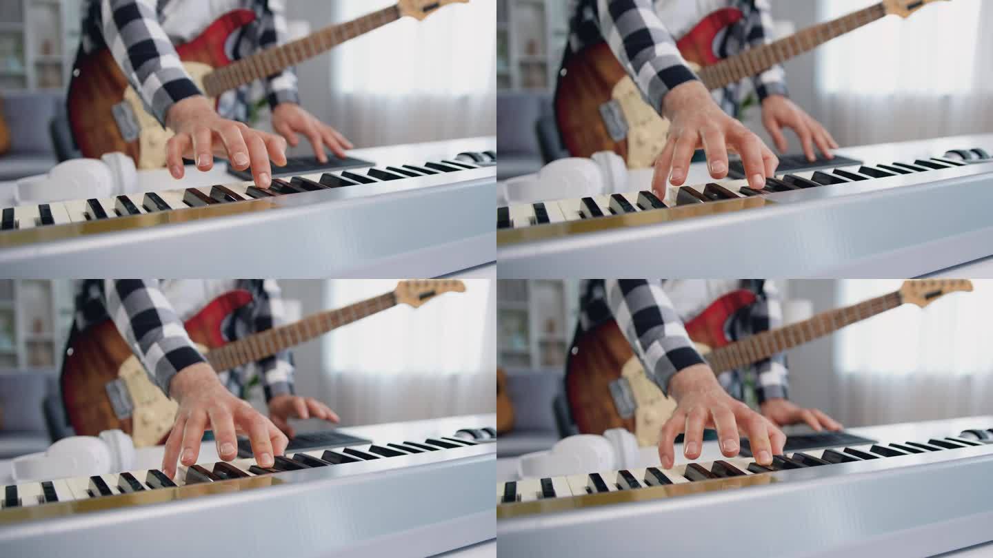 近距离的男性手演奏midi钢琴键盘和合成器在家庭工作室。男人在家制作电子音乐。音乐家在家庭音乐工作室