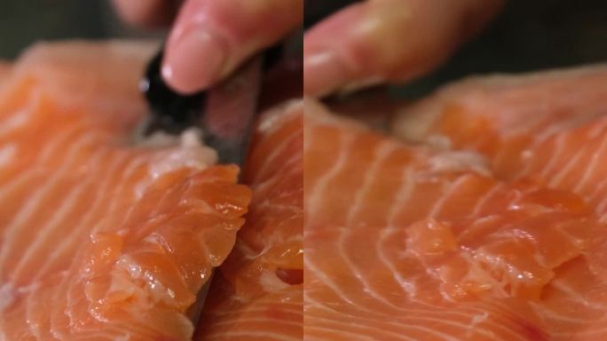 腌制红鲑鱼的过程，把鱼从壳上剥下来，盖上盐，腌制一会儿美味的健康食品天然产品海鲜女手特写清洁鱼