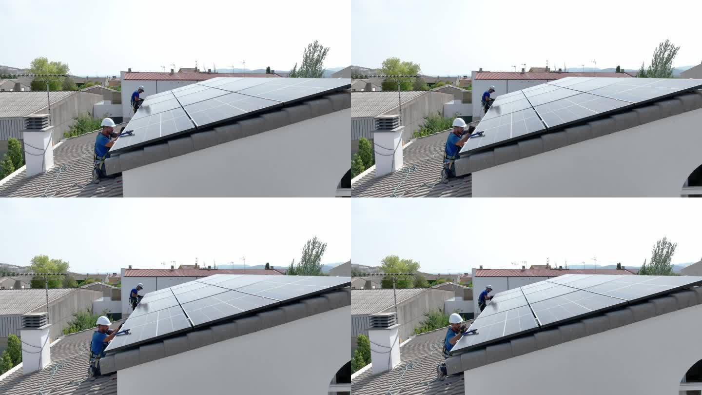专业技术人员专业工程师维护检查在阳光下安装太阳能屋顶板。工程师小组检查太阳能板屋顶