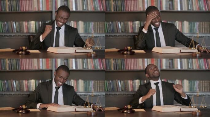 出庭前，激动的非洲男律师在办公室阅读法律书籍