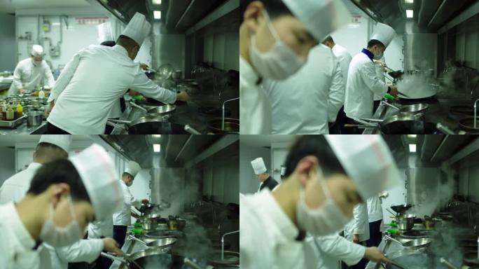 饭店后厨忙碌做饭的场景视频