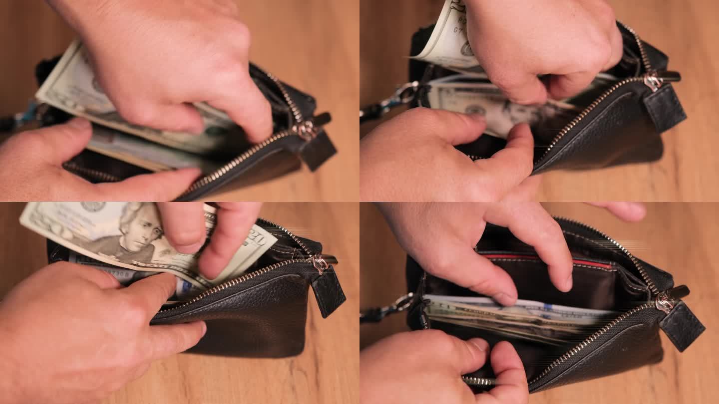 男人把手伸进钱包里的现金，掏出一张20美元的美国国币