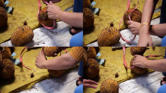 塔拉干传统市场的榴莲莱卖主活动。套榴莲。